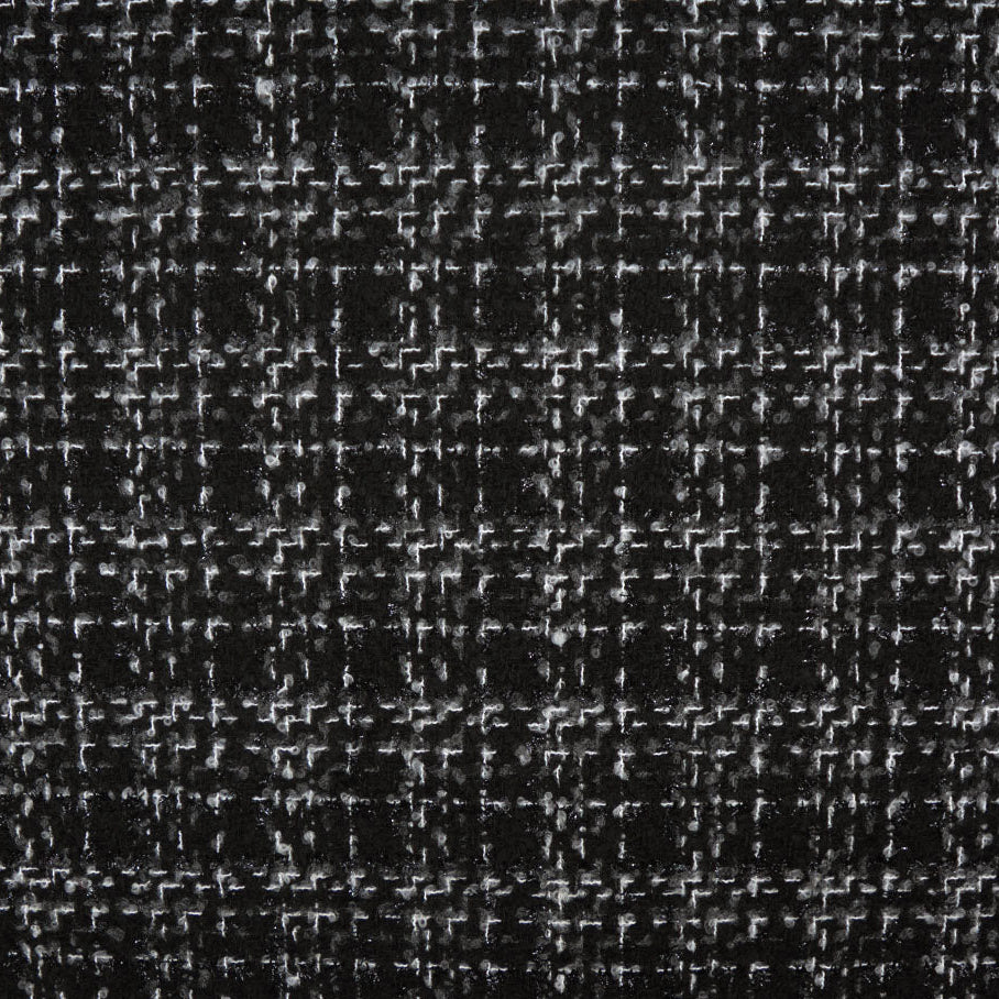 Close-up of a textured black fabric with a subtle pattern